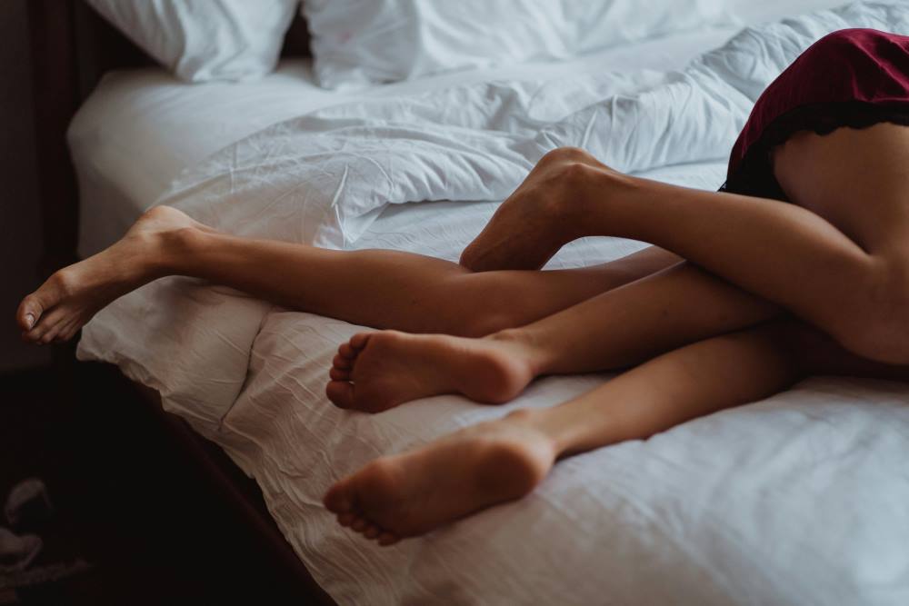 A couple lying in bed together